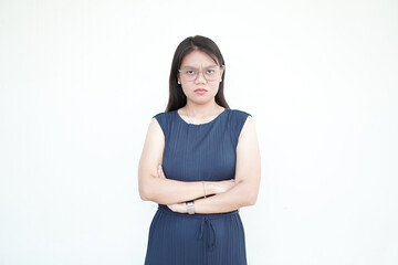 Beautiful Asian woman with an angry expression points directly at you, emphasizing frustration on a white background