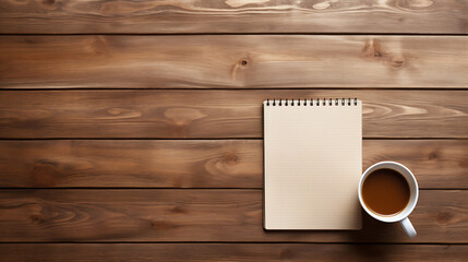 cozy workspace with coffee cup and notepad on wooden table