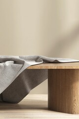 Brown wooden podium table with gray cotton throw blanket in sunlight on beige wall for luxury, elegant cosmetic, skincare, body care, beauty product display background 3D