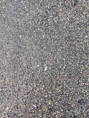 Portrait of sand and small rocks on the beach