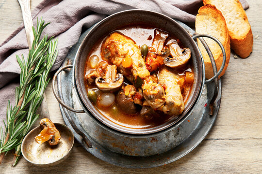 Coq au vin or rooster, cock with wine.