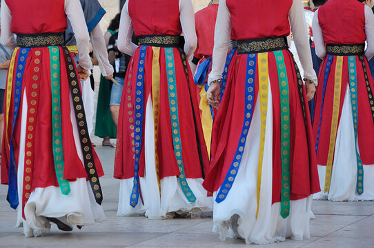 Dancers parading and wearing one of the traditional folk costume from South Korea