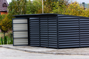 Organization of garbage containers in the neighborhood. Metal profile cover.
