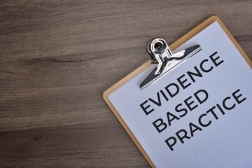 A paper clipboard with a white sheet of paper with text 