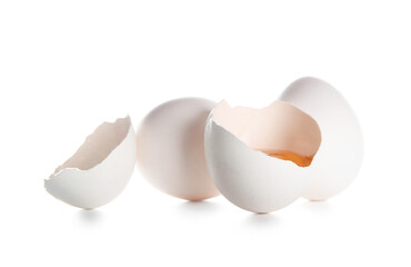 Cracked and whole chicken eggs isolated on white background, closeup