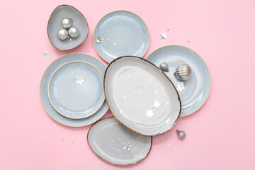 Beautiful table setting and Christmas decoration on pink background