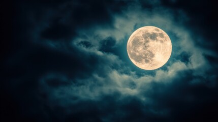 A full moon shines brightly in the night sky, partially obscured by wispy clouds.