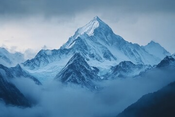 A majestic snow-capped mountain peak rises above a sea of clouds, creating a dramatic and ethereal landscape.