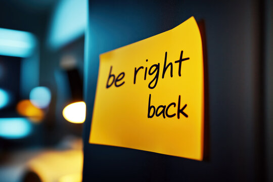 Yellow Sticky Note with "Be Right Back" Message, Office Break, Informal Communication, Close-Up