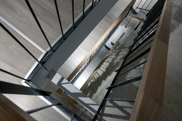 Modern Architectural Staircase Design with Wooden and Metal Elements