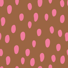 Seamless pattern with pink polka dots on brown background.