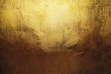Gold Paint on Grunge Concrete Wall Texture Background.