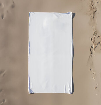 Beach towel mockup on sand, AI-Generated