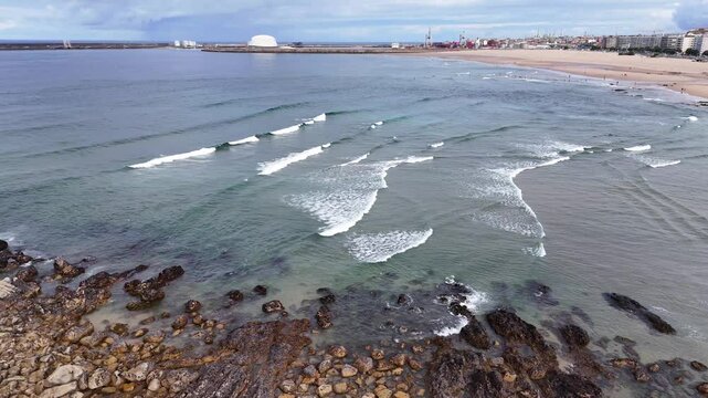 Portugal beach - an aerial shot of the sandy Matosinhos beach at the Atlantic Ocean.