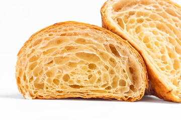 Cut in Half Croissant with Inside Texture and Thin Crisp Layers. Delicious French Pastry. Light background.