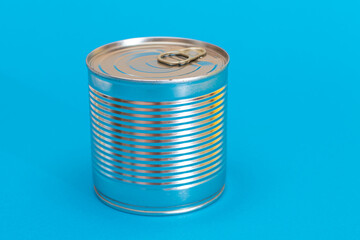 Tin Can on Blue Background. Canned Food. Aluminum Can for Safe and Long Term Storage of Food. Steel Sealed Food Storage Container