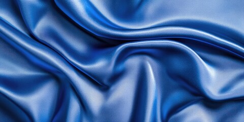 Obraz premium Texture. Background. Blue silk fabric, top view. The smooth, elegant texture of blue silk or satin fabric can serve as an abstract background with copy space.