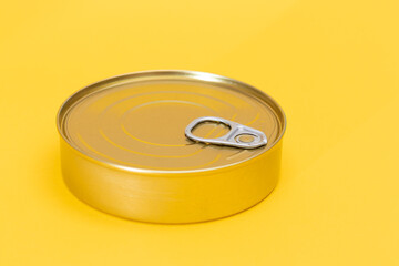 Tin Can on Yellow Background. Canned Food. Aluminum Can for Safe and Long Term Storage of Food. Steel Sealed Food Storage Container