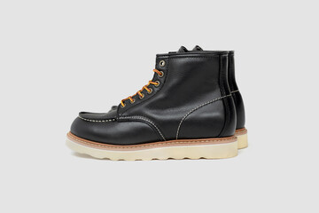 Black leather boots on white background. Fashio