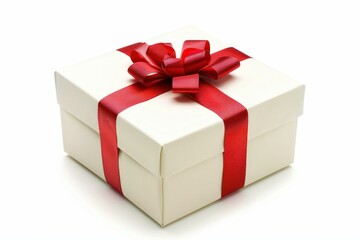 Obraz premium White gift box with a red ribbon is laying on a white background