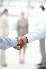 Business, people and handshake at office with deal for partnership, teamwork and collaboration....