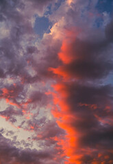 dramatic and colorful sunset clouds in summer time