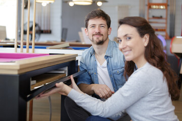 happy pool seller holding ball and smiling