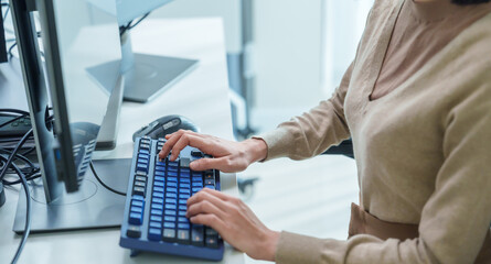 close up  developer hand coding with keyboard on desk  at modern office