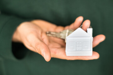 Keys in your hand to your own house or apartment. Real estate market.
