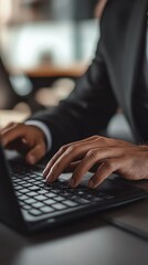 Close-up of Hands Typing on Laptop