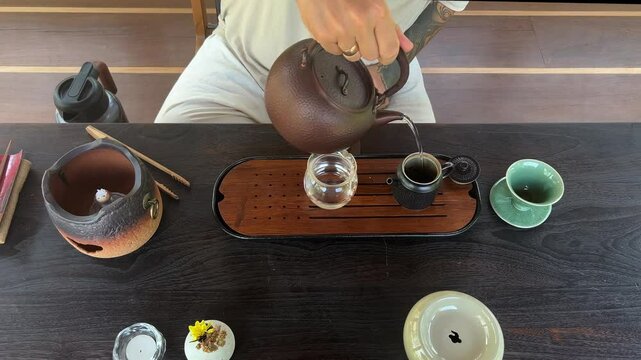 Tea ceremony with Chinese puer tea, top view. Dark background