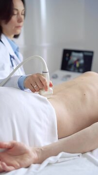 Doctor performing ultrasound examination on patient's back