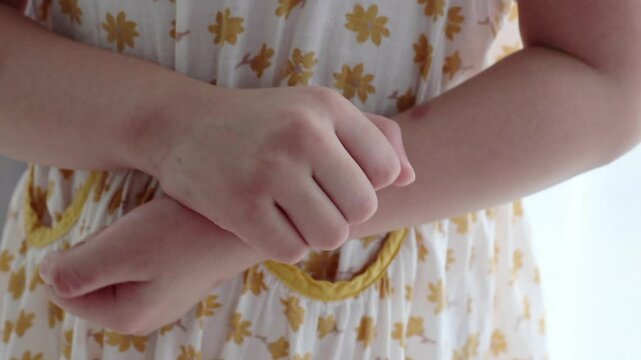 Little girl has skin rash allergy itching and scratching on her arm