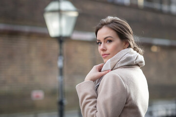 Fototapeta premium portrait of a woman with beige coat