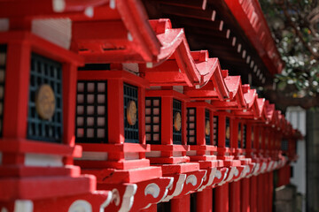 Traditional Bright Reddish Orange Japanese Tourou Lanterns Line the Outer Wall of a Small Japanese ...