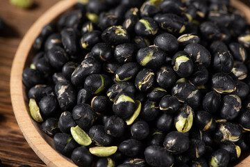 Black Soybean baked roasted fried shell cracked on table.
