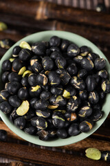 Black Soybean baked roasted fried shell cracked on table.