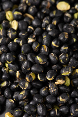 Black Soybean baked roasted fried shell cracked background.