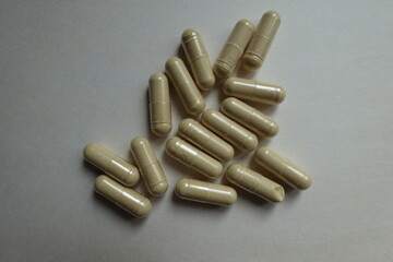 Top view of group of beige capsules of Saccharomyces boulardii probiotic dietary supplement