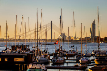 Riga Kipsala yacht port and marina with Riga skyline in the background at early morning before the...