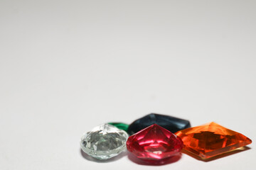 colourful gemstones on white background