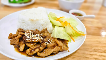 Fried Pork with gravy served with rice and vegetables.