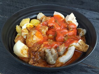 Siomay or Indonesian traditional foods on the wooden table. Indonesian cuisine culinary.