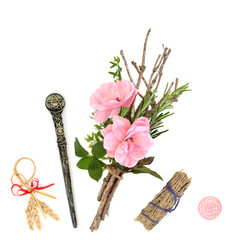 Witches bundle magical equipment of herbs, twigs, rose flower, magic wand, smudge stick and corn...