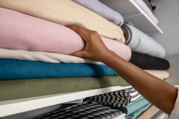 Fototapeta premium Unrecognizable woman designer choosing materials in fabric store