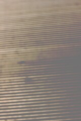 A vague view of an industrial metal grill.