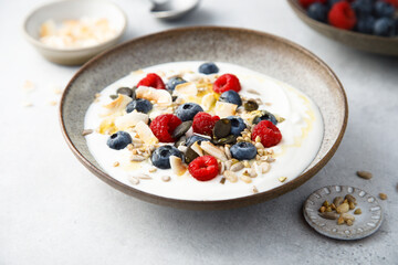 Granola with yogurt, fresh berries and coconut