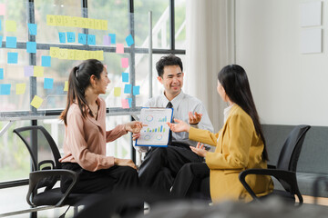 Collaborative Brainstorming: A diverse team of business professionals engaged in a lively discussion around a whiteboard, showcasing the dynamic energy of a successful brainstorming session.