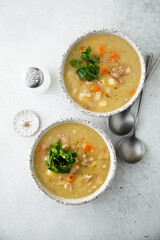 Homemade pea soup with smoked meat