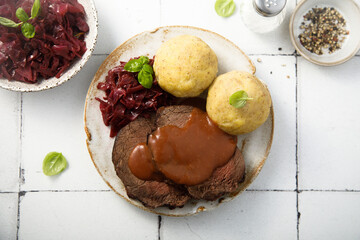Roasted meat with red cabbage and potato dumplings